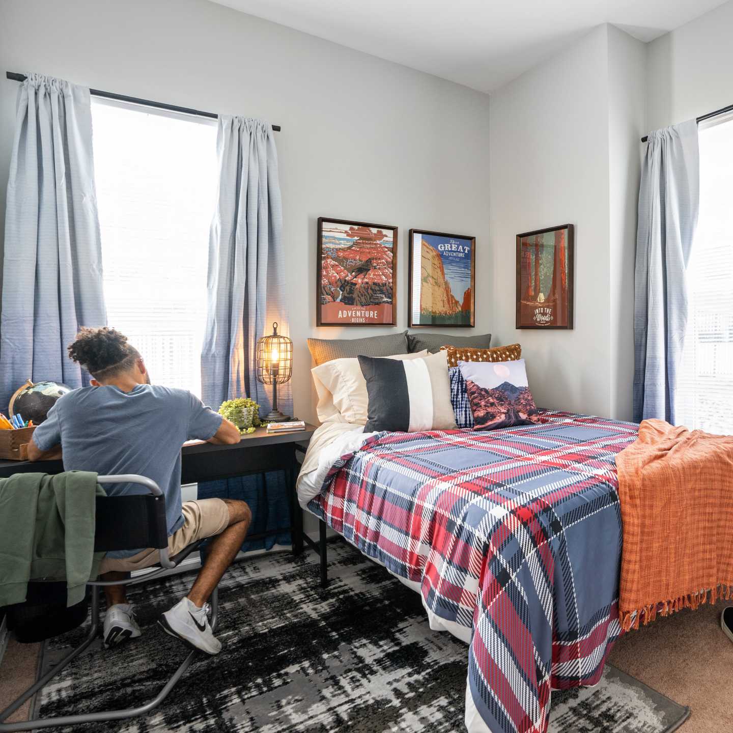 A person studying in their bedroom